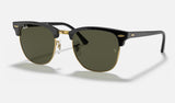 Ray-Ban Clubmaster RB3016 — Black on Gold / G-15 Green — quarter view