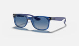 Ray-Ban Junior Junior New Wayfarer RJ9052S — Transparent Blue — quarter view