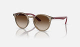 Ray-Ban Junior RJ9064S — Transparent Brown / Brown — quarter view
