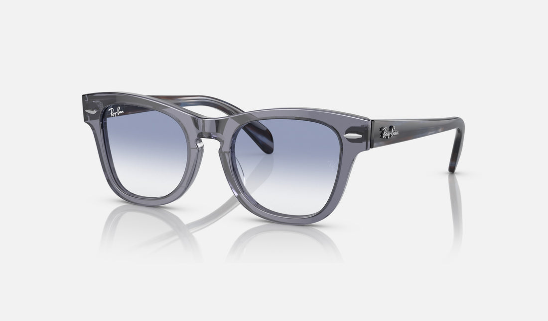 Ray-Ban Junior RJ9707S — Transparent Blue / Blue — quarter view